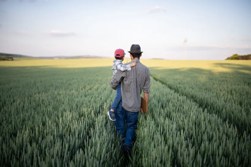 Man-with-child-in-field